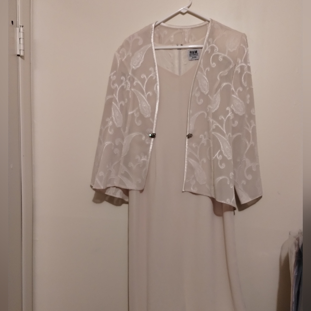 A cream colored mother of the bride evening dress.